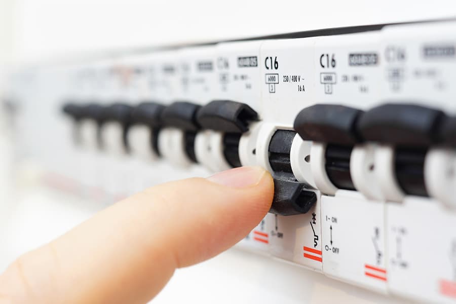 A circuit being isolated by flipping the breaker to the off position.