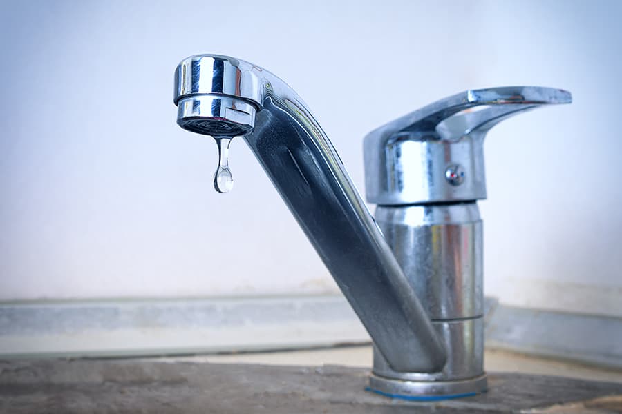 A dripping ceramic disc tap.
